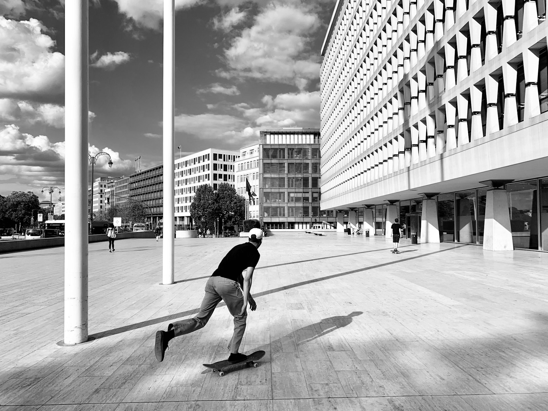 a man riding a skateboard on top of a wooden floor